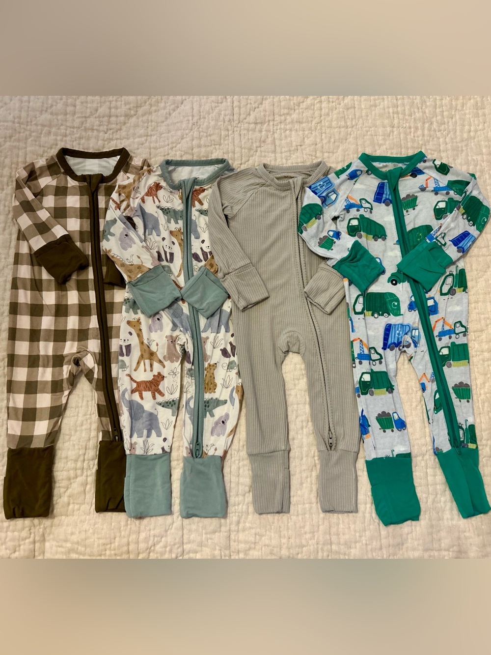 4 footies: 3 Little Sleepies 1 Silks Design 0-3 months